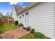 Cozy backyard patio and side entry door with vinyl siding and partial fencing at 104 Clovis Circle, Myrtle Beach, SC 29579