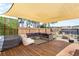 Beautiful backyard deck with outdoor sectional seating, lounge chairs, and a shade at 104 Clovis Circle, Myrtle Beach, SC 29579