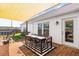 Backyard deck and patio with shade, grill, pool, and seating at 104 Clovis Circle, Myrtle Beach, SC 29579