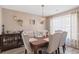 Elegant dining room features a stylish table with upholstered chairs, decorative accents, and natural lighting at 104 Clovis Circle, Myrtle Beach, SC 29579