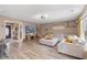 Open-concept living area flows seamlessly, showcasing a comfortable sofa, modern lighting, and stylish decor at 104 Clovis Circle, Myrtle Beach, SC 29579