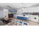 Open-concept living room and kitchen area with kitchen island, modern appliances, and stylish decor at 104 Clovis Circle, Myrtle Beach, SC 29579