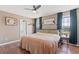 Comfortable main bedroom features hardwood floors, natural lighting and a ceiling fan at 104 Clovis Circle, Myrtle Beach, SC 29579