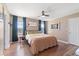Bright main bedroom featuring a ceiling fan, hardwood floors and an inviting aesthetic at 104 Clovis Circle, Myrtle Beach, SC 29579