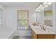 Bright bathroom with a window view and updated vanity at 1140 Waterway Ln., Myrtle Beach, SC 29572