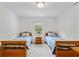 Symmetrical bedroom with matching twin beds, blue linens, and nightstand at 1140 Waterway Ln., Myrtle Beach, SC 29572