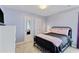Cozy bedroom with plush carpet, pastel blue wall paint, and black metal bedframe at 1140 Waterway Ln., Myrtle Beach, SC 29572
