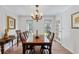 Traditional dining room with wood floors, a chandelier, and a large table for Gathering gatherings at 1140 Waterway Ln., Myrtle Beach, SC 29572