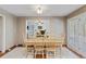 Inviting dining area with a wooden table, chairs, and a view into the living room at 1140 Waterway Ln., Myrtle Beach, SC 29572