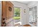 Inviting front entry with a wood door opening to a view of the landscaped front yard at 1140 Waterway Ln., Myrtle Beach, SC 29572