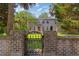 Charming two-story home with a brick facade and an ornate wrought iron gate at 1140 Waterway Ln., Myrtle Beach, SC 29572
