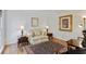 Cozy living room featuring hardwood floors, a comfortable sofa, and tasteful decor at 1140 Waterway Ln., Myrtle Beach, SC 29572