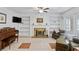 Open concept living room with a fireplace, built-in shelving, and neutral tile flooring at 1140 Waterway Ln., Myrtle Beach, SC 29572