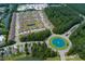 Aerial view of community with mature landscaping, ponds, pool and townhomes at 115 Machrie Loop # D, Myrtle Beach, SC 29588