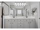 Bathroom with double vanity, large mirror, and modern lighting fixtures at 115 Machrie Loop # D, Myrtle Beach, SC 29588