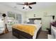Cozy bedroom with a window, guitar, and desk at 115 Machrie Loop # D, Myrtle Beach, SC 29588