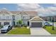 Charming townhome with a well-manicured lawn, neutral siding, and an attached garage at 115 Machrie Loop # D, Myrtle Beach, SC 29588