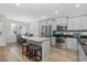 Bright kitchen with stainless steel appliances, granite countertops, and a breakfast bar island at 115 Machrie Loop # D, Myrtle Beach, SC 29588