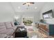 Cozy living room with comfortable seating, outdoor access, and a stylish entertainment center at 115 Machrie Loop # D, Myrtle Beach, SC 29588