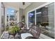 Relaxing screened porch with comfortable seating, ideal for enjoying the outdoors at 115 Machrie Loop # D, Myrtle Beach, SC 29588