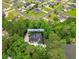 Aerial view of 116 Chapel Ridge Cir. The home is surrounded by mature trees, a pond and neighboring homes at 116 Chapel Ridge Circle, Myrtle Beach, SC 29588