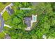 Aerial view outlining approximate lot lines of a property with a pool and surrounded by lush greenery and trees at 116 Chapel Ridge Circle, Myrtle Beach, SC 29588
