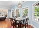 Bright dining area features large windows and a modern pendant light fixture at 116 Chapel Ridge Circle, Myrtle Beach, SC 29588