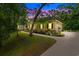 Charming one-story home with manicured landscaping, walkway, driveway, and attached garage surrounded by mature trees at 116 Chapel Ridge Circle, Myrtle Beach, SC 29588