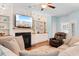 Inviting living room with built-in shelves, comfortable sofas, and a cozy fireplace, perfect for relaxation at 116 Chapel Ridge Circle, Myrtle Beach, SC 29588