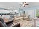 Open-concept living area featuring a spacious seating arrangement, hardwood floors, and a view of the kitchen at 116 Chapel Ridge Circle, Myrtle Beach, SC 29588