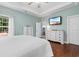Bright main bedroom features a tray ceiling, hardwood floors and neutral paint at 116 Chapel Ridge Circle, Myrtle Beach, SC 29588