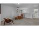Bright, carpeted bonus room with stylish furnishings and modern lighting fixtures at 1168 Baker Creek Loop, Myrtle Beach, SC 29579