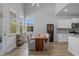 Bright dining area with wood table, comfortable seating, and views of the outdoors at 1168 Baker Creek Loop, Myrtle Beach, SC 29579