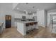 Kitchen featuring white cabinets, granite counters, stainless appliances, and a convenient island at 1168 Baker Creek Loop, Myrtle Beach, SC 29579