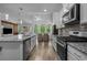 Spacious kitchen with a center island, modern appliances, and ample counter space for cooking at 1168 Baker Creek Loop, Myrtle Beach, SC 29579