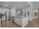 Kitchen with stainless steel appliances and a central island with bar stool seating at 1168 Baker Creek Loop, Myrtle Beach, SC 29579