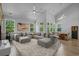 Spacious living room with vaulted ceilings, large sectional sofa, and open floor plan at 1168 Baker Creek Loop, Myrtle Beach, SC 29579