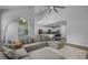 Spacious living room with large sectional, modern lighting, and view into the modern kitchen at 1168 Baker Creek Loop, Myrtle Beach, SC 29579