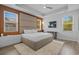 Relaxing bedroom with stylish headboard, wood accents, and lots of natural light at 1168 Baker Creek Loop, Myrtle Beach, SC 29579