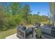 This outdoor patio features comfortable outdoor seating and faces abundant landscaping at 1168 Baker Creek Loop, Myrtle Beach, SC 29579