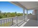 This lovely porch overlooks a green street with abundant landscaping at 1168 Baker Creek Loop, Myrtle Beach, SC 29579