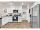Bright kitchen featuring stainless appliances, granite countertops and white cabinetry at 1170 Maxwell Dr., Little River, SC 29566