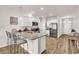 Modern kitchen with granite countertops, stainless steel appliances, and a breakfast bar seating three at 1170 Maxwell Dr., Little River, SC 29566