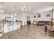 Expansive living area with a kitchen island, hard wood flooring, and modern lighting at 1170 Maxwell Dr., Little River, SC 29566