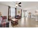 Spacious living room with hardwood flooring, a ceiling fan, and natural lighting at 1170 Maxwell Dr., Little River, SC 29566