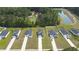 Birds eye view of homes with long driveways and green lawns, backing up to a golf course and pond at 120 Carolina Lakes Blvd., Myrtle Beach, SC 29588