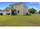 Expansive backyard with a covered patio and outdoor seating, perfect for entertaining and enjoying the outdoors at 120 Carolina Lakes Blvd., Myrtle Beach, SC 29588
