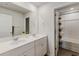 Well-lit bathroom with a double vanity, a large mirror, and a shower-tub combo with modern finishes at 120 Carolina Lakes Blvd., Myrtle Beach, SC 29588