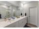 Bathroom with dual sinks, a large mirror, and a separate shower, offering a spa-like experience at 120 Carolina Lakes Blvd., Myrtle Beach, SC 29588