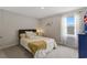 This bedroom features a window with sheer curtains, carpet flooring, and is brightly illuminated with natural light at 120 Carolina Lakes Blvd., Myrtle Beach, SC 29588